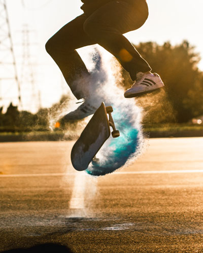 man skateborading through water