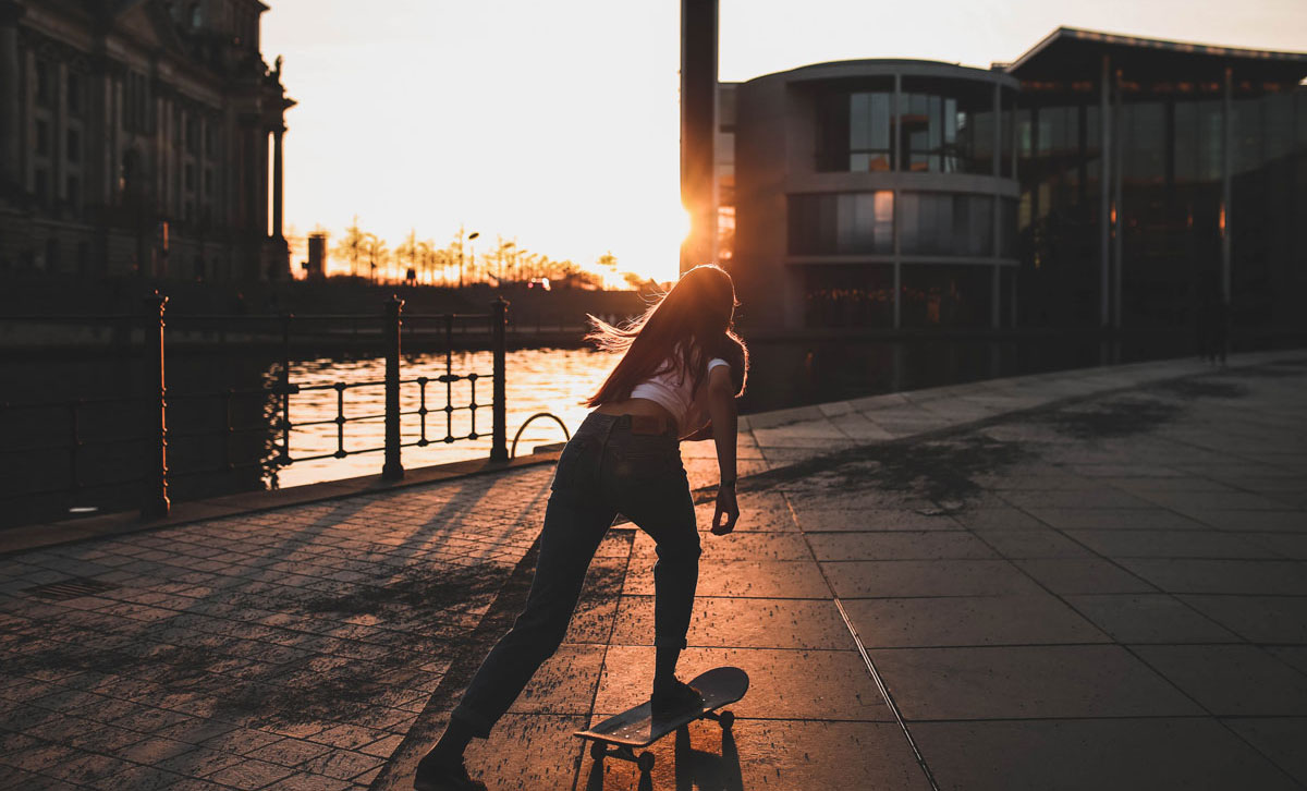 girl skating at sunset